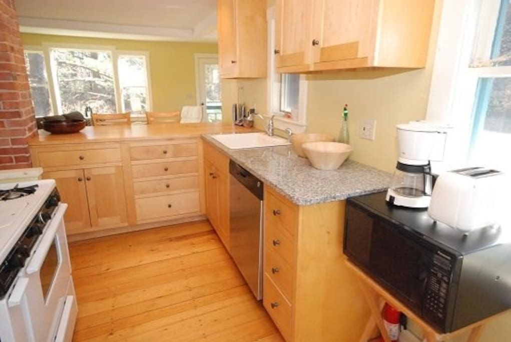 Kitchen looking toward living room and nature preserve