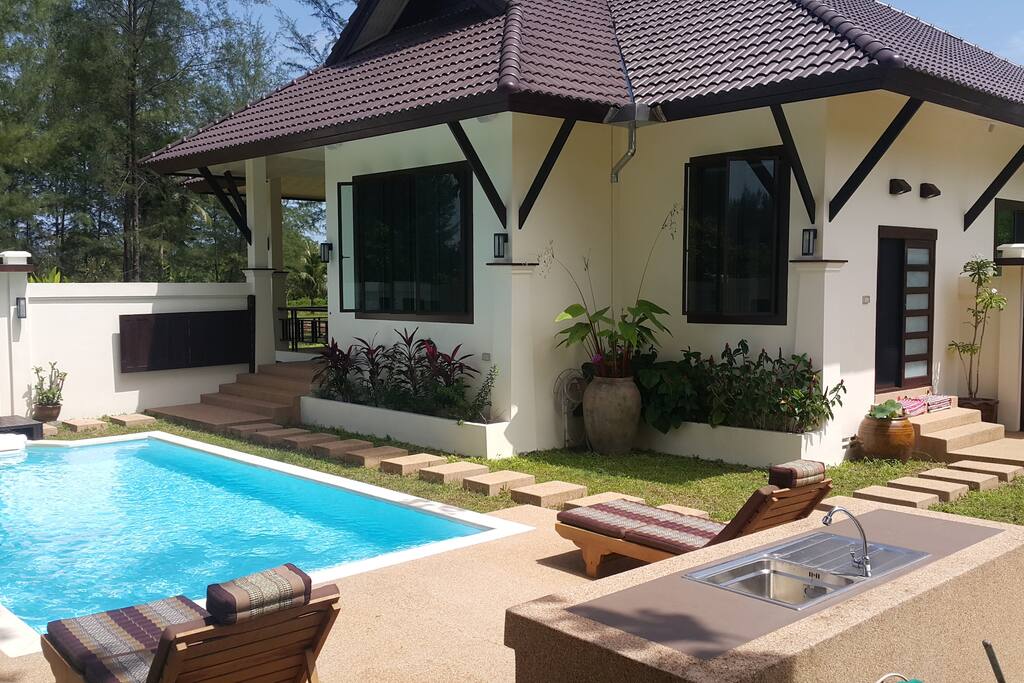 Relax on the deck chairs by the Pool