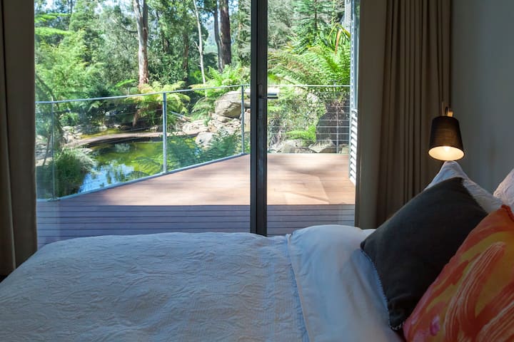 Bedroom 2, views to natural pool