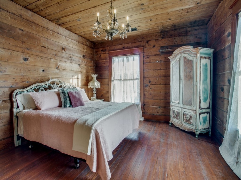 The Green Room. Sleeps 2 with lovely vanity, nightstand and armoire. Crystal touches all throughout. Stocked with extra blankets and pillows. Top Floor.