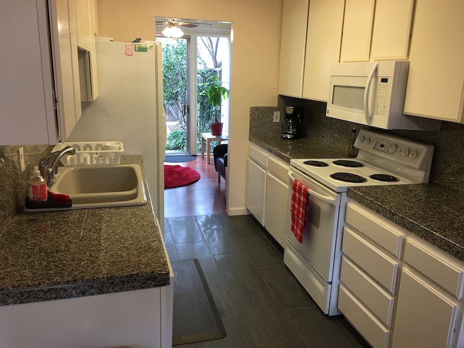Kitchen with microwave, dishwasher and coffeemaker