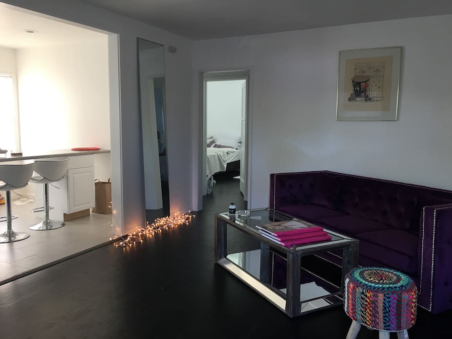 The living room with open floor to the kitchen & dining area