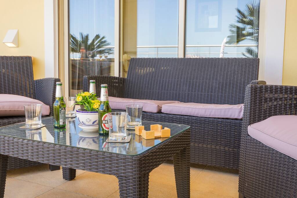 Relaxing on the terrace with marina and Atlantic views.