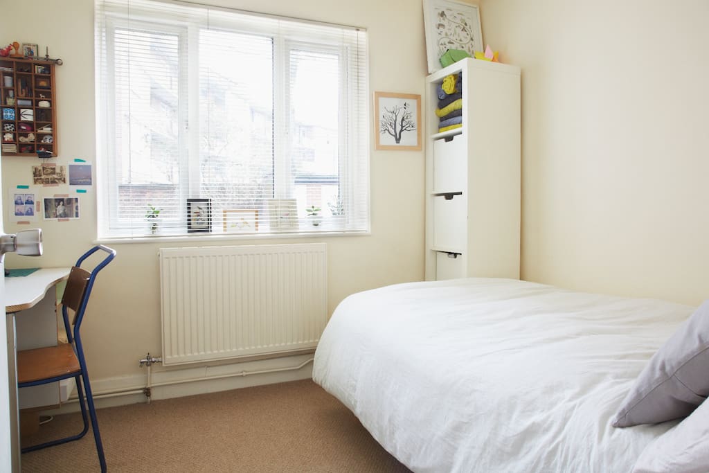 3/4 sized double bed in very quiet Guest bedroom looking out onto a private shared back garden.