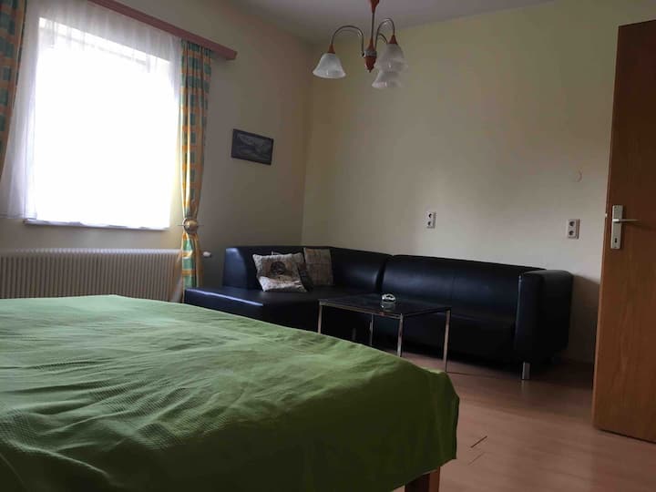 Room with double bed (180x200cm) and sofa 