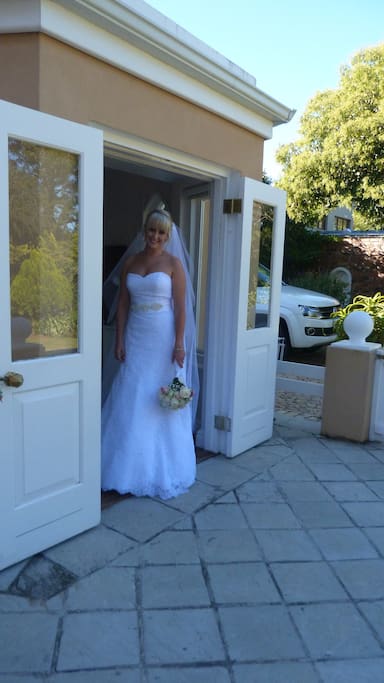Bride on her way to the church in the Cottage bedroom doorway