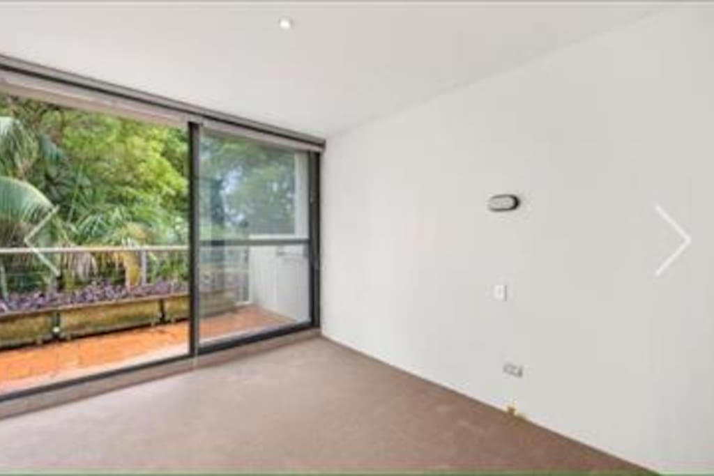 Bedroom is furnished with Queen size bed and built in wardrobe.