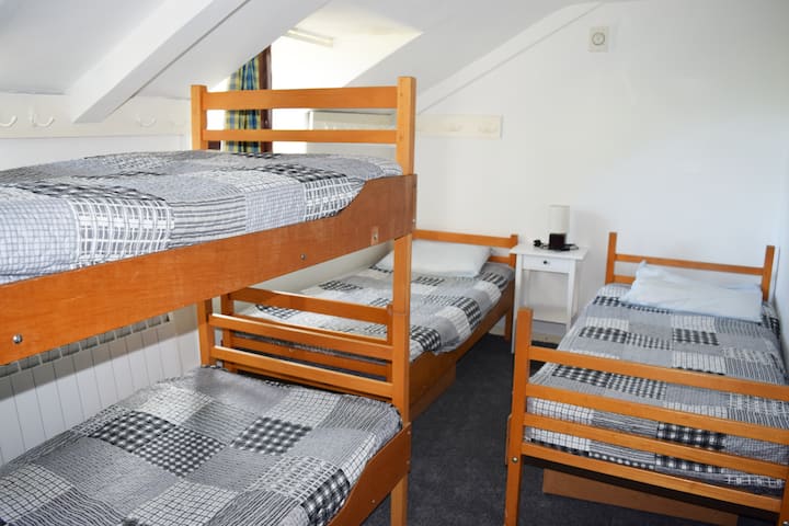 Third bedroom with 2 single beds and 1 bunk bed. 

4 beds in total.