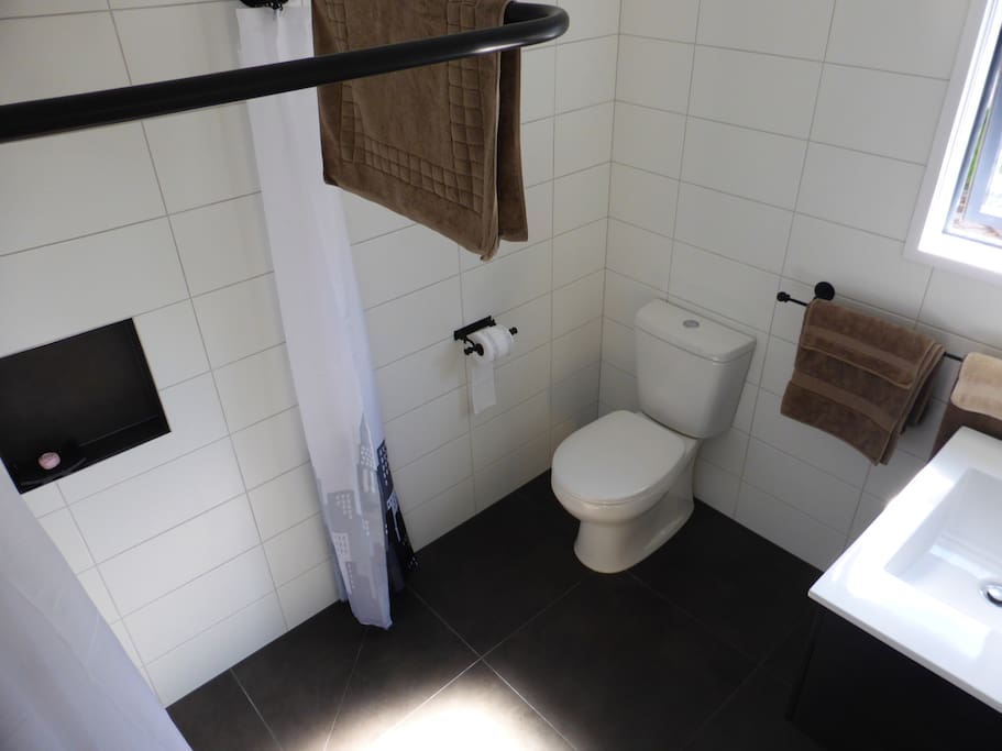 Fresh fully tiled bathroom