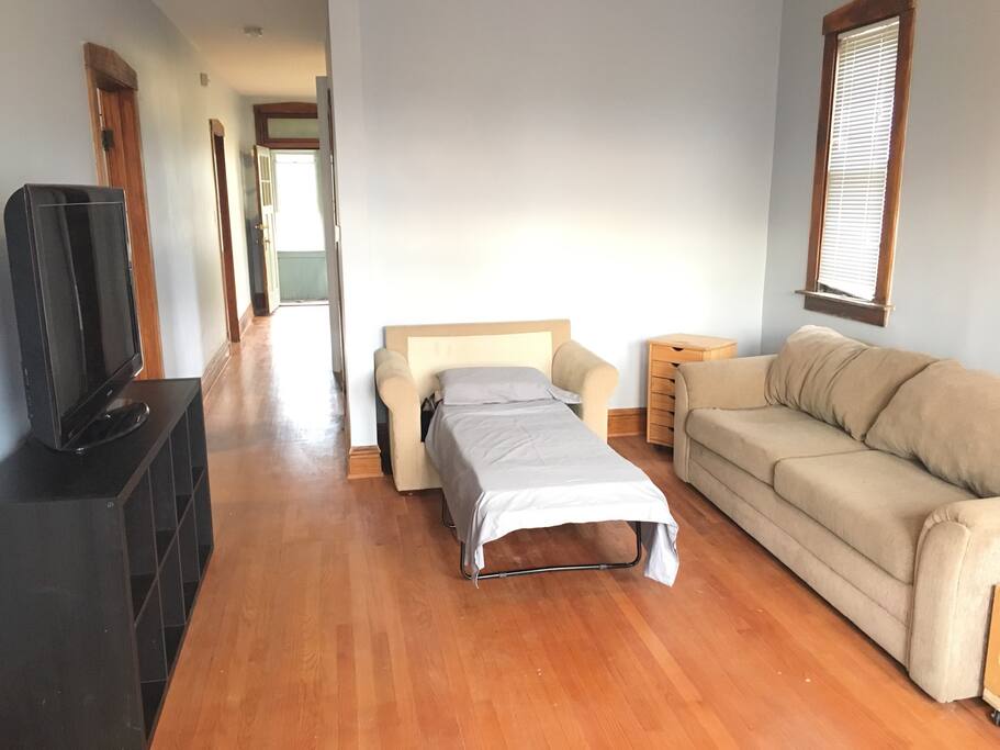 Living Room 1.5 chair pulls out to a twin bed. The couch does not pull out into a bed.