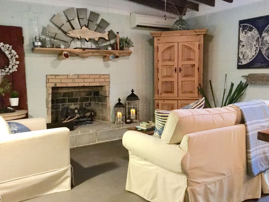 The living room features a masonry fireplace with gas logs. The TV, DVD player, a wide variety of movies, and board games are provided for rainy day entertainment or if you get tired of the peace and quiet.