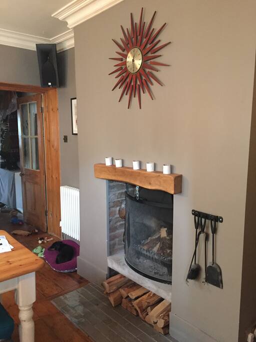 Spacious dining room with open fire and large table