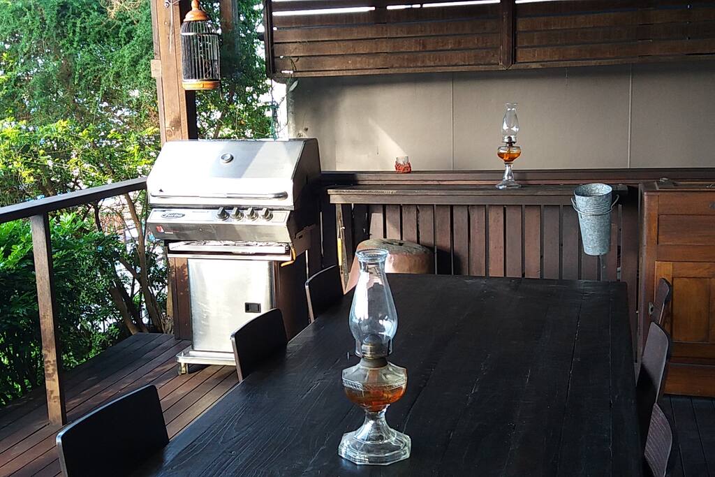 BBQ and large table for outside dining.