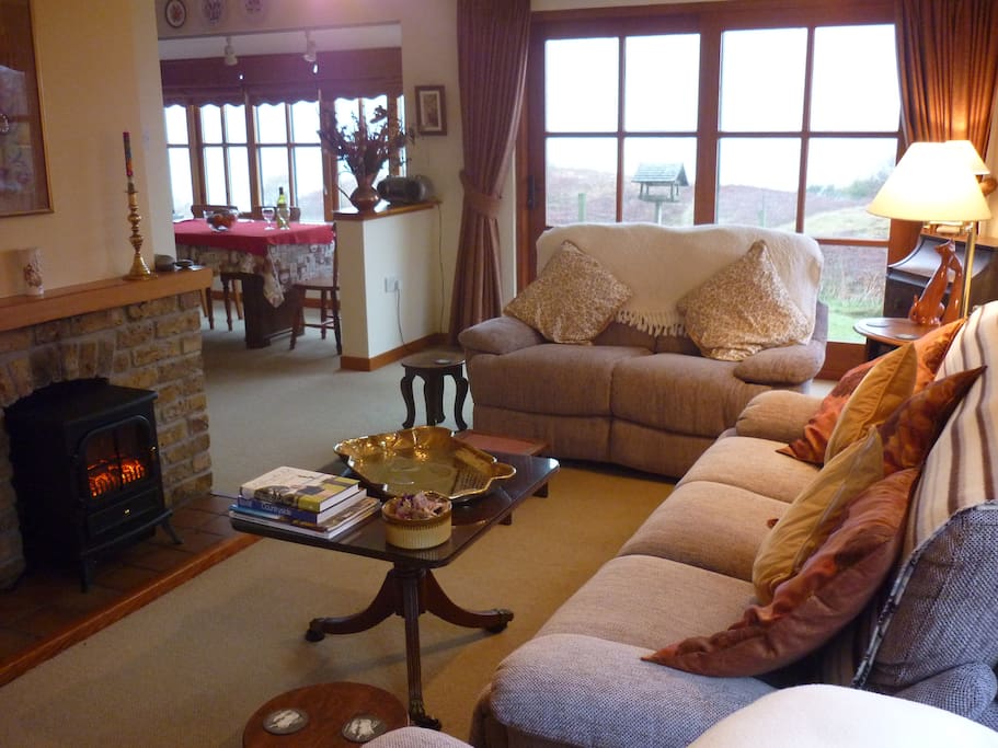 Sitting room, French windows to garden, dining room in bay window