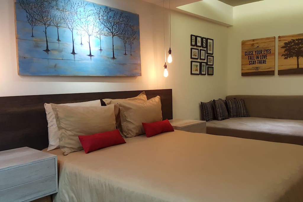 Spacious space with queen size bed and huge sofa that can be used as bed for extra person