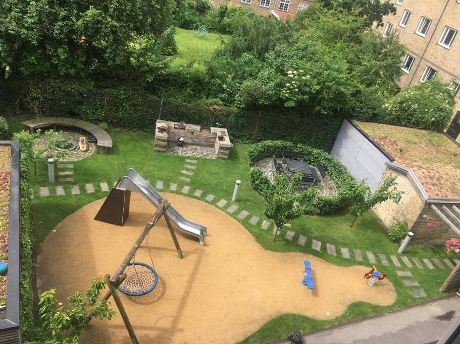 Court yard with play ground and barberque.