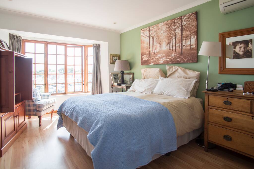 Main bedroom upstairs with ensuite toilet, sink and bath. Tv with DSTV. Cupboard space