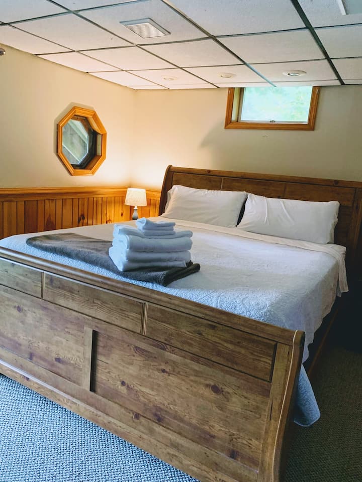 King bed in downstairs master with  lake view.