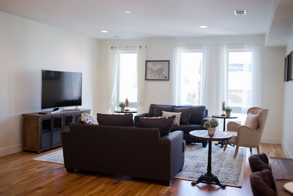 Main living room with super comfy sofa-bed, fully stocked kitchen with plenty of coffee and amenities. If you need any additional cookware, just let us know and we will buy for you! Everything is brand new!
