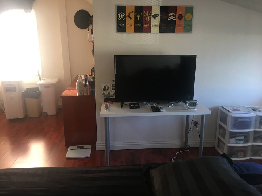 This is the TV with a mirrored dresser on the other side