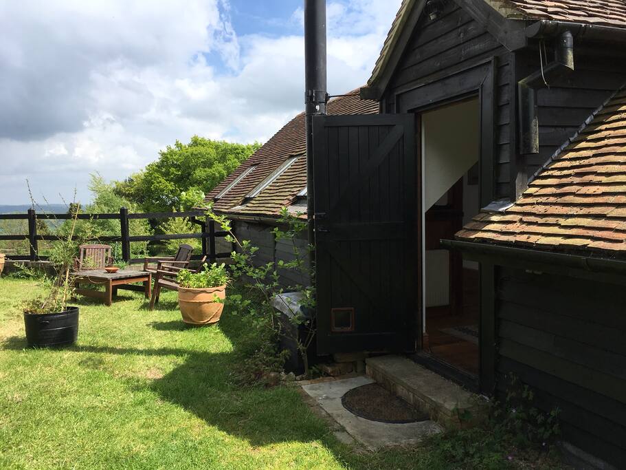 Private entrance, seating area and barbeque