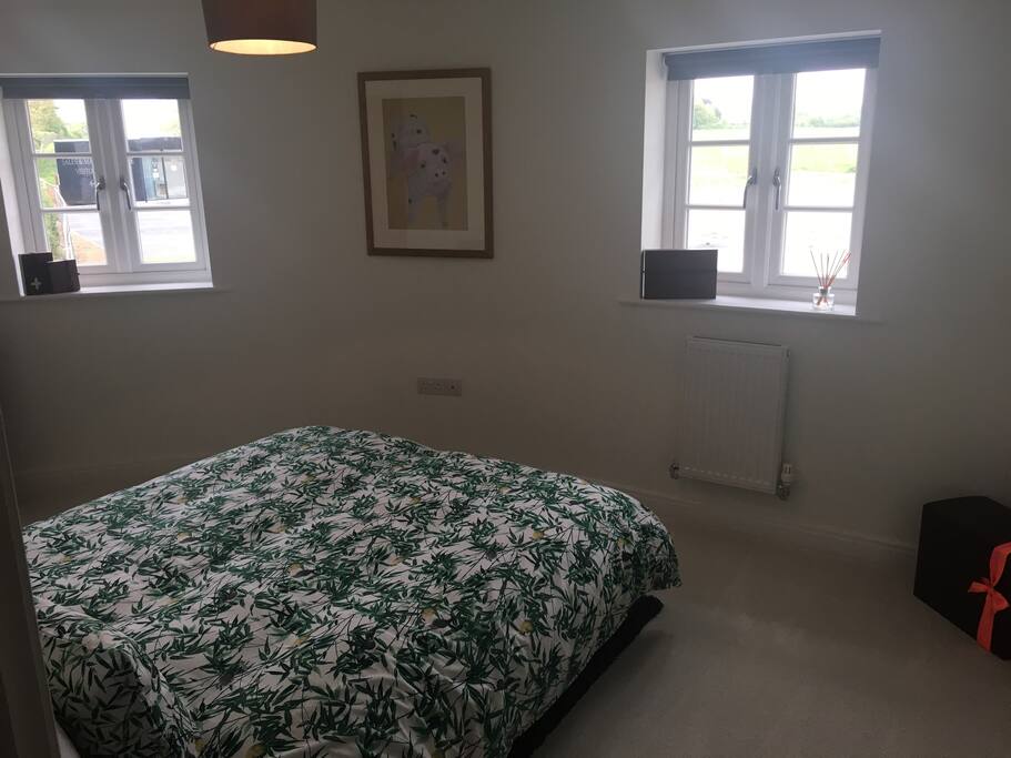 King size bed with double window outlook across to fields