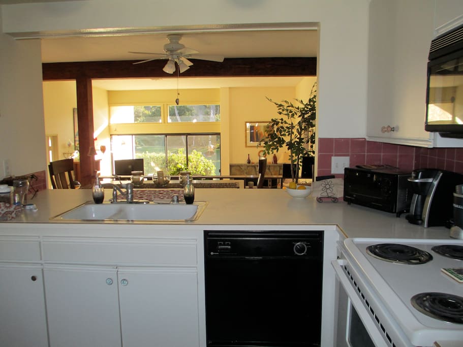 Large kitchen with toaster, coffee maker, dishwasher, microwave