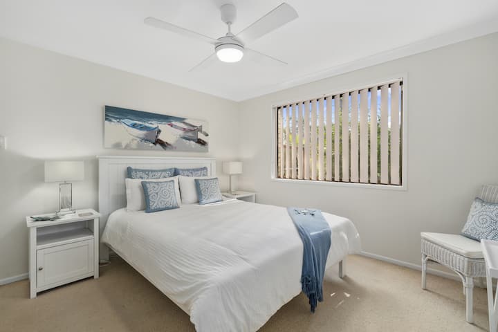 Garden view queen bedroom with aircon and fan