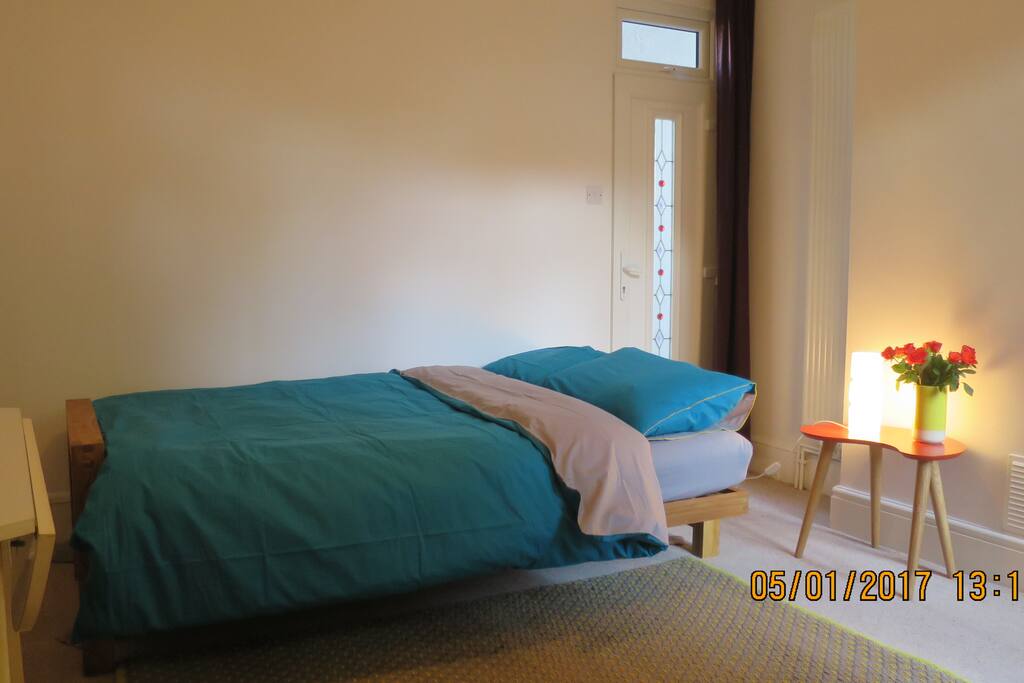 Room with comfy Futon sofa bed