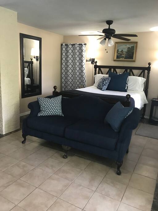 Another view of the bed and the full-length mirror.