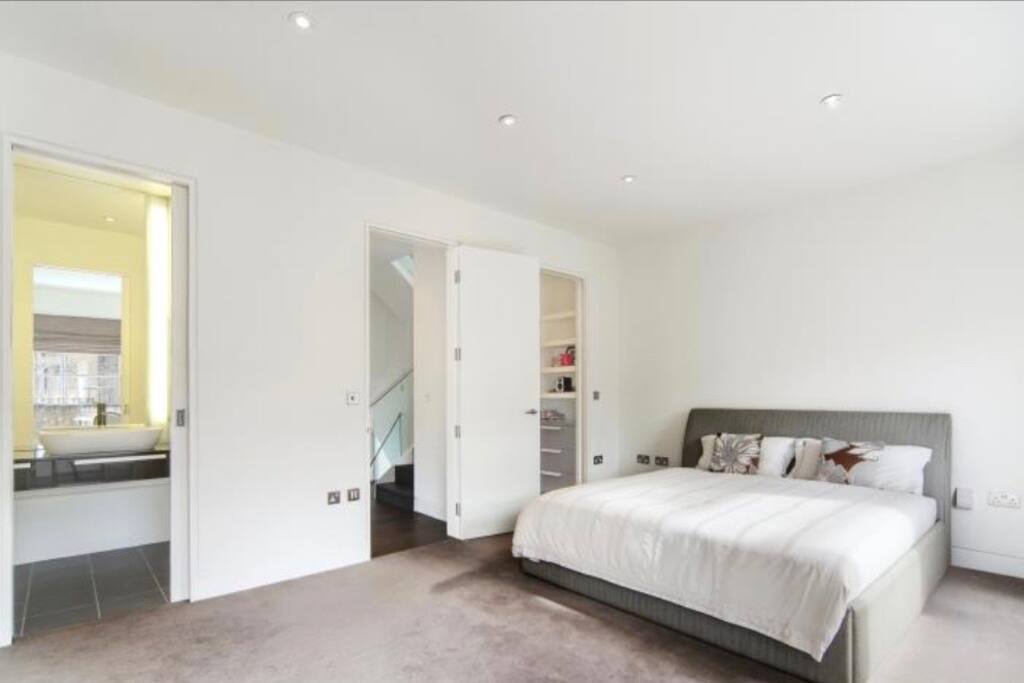 Master bedroom with king size bed, dressing and bathroom in suite