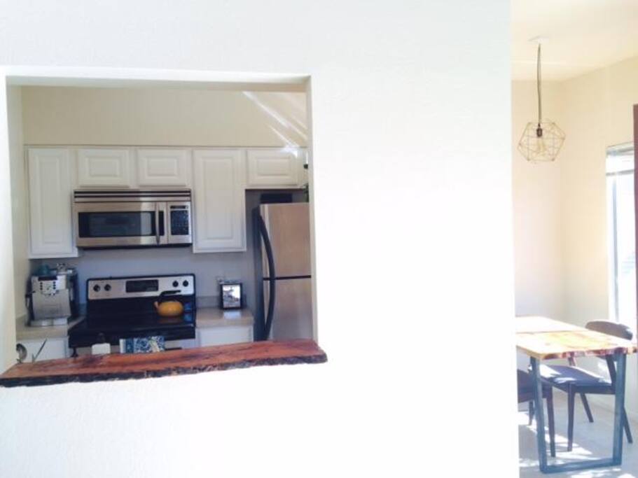 Bright open and recently remodeled cooks kitchen with touches made by local artists