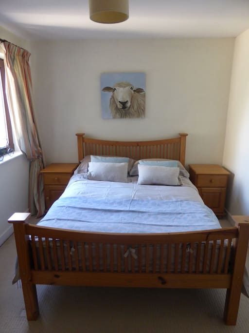 Bright bedroom with view over gardens