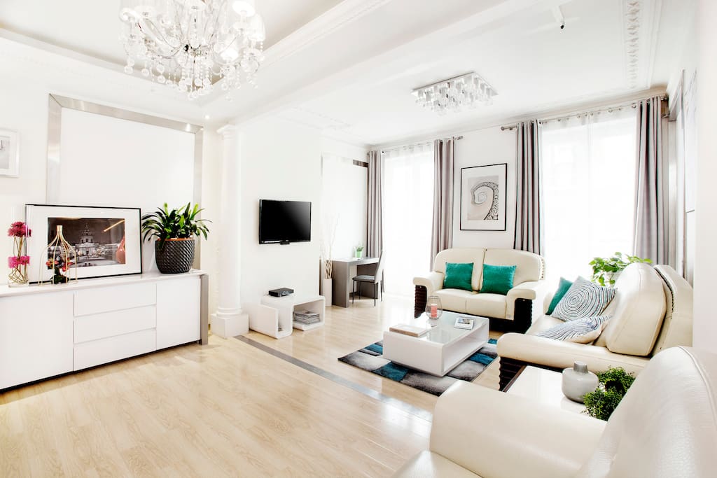 Spacious First Living room with a desk and a TV with over 100 channels