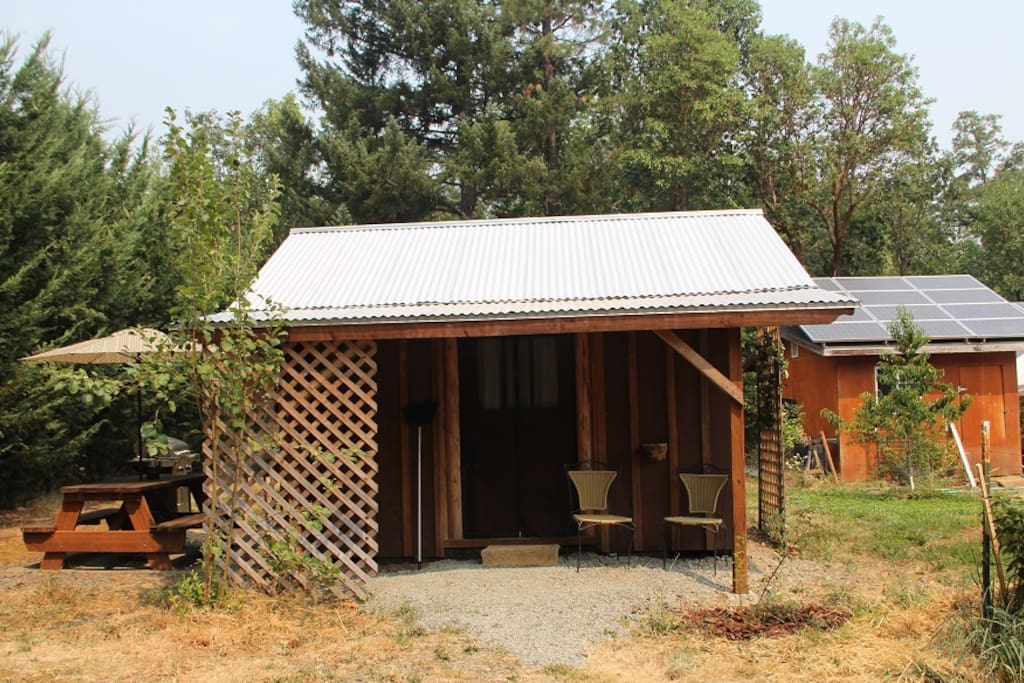 Front door, outdoor kitchen and picnic to the right
