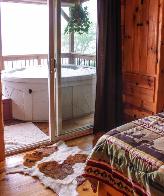 Master bedroom with hot tub just steps away.