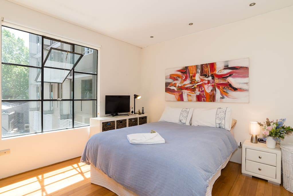 Comfortable bedroom with grand window