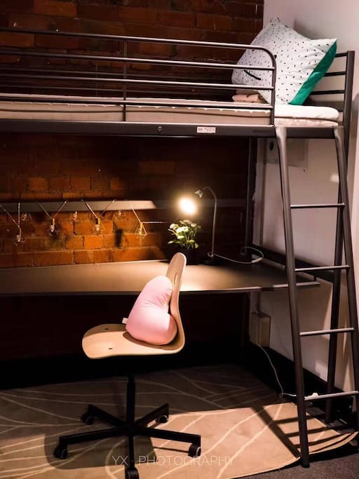 You can enjoy your own blanket, pillow and throw pillow. Small lamp on the desk is also provides.