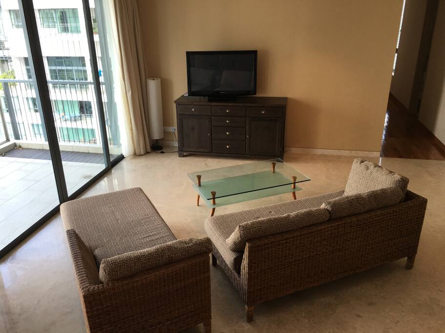 Spacious living area with a pool view that overlooks the Singapore River