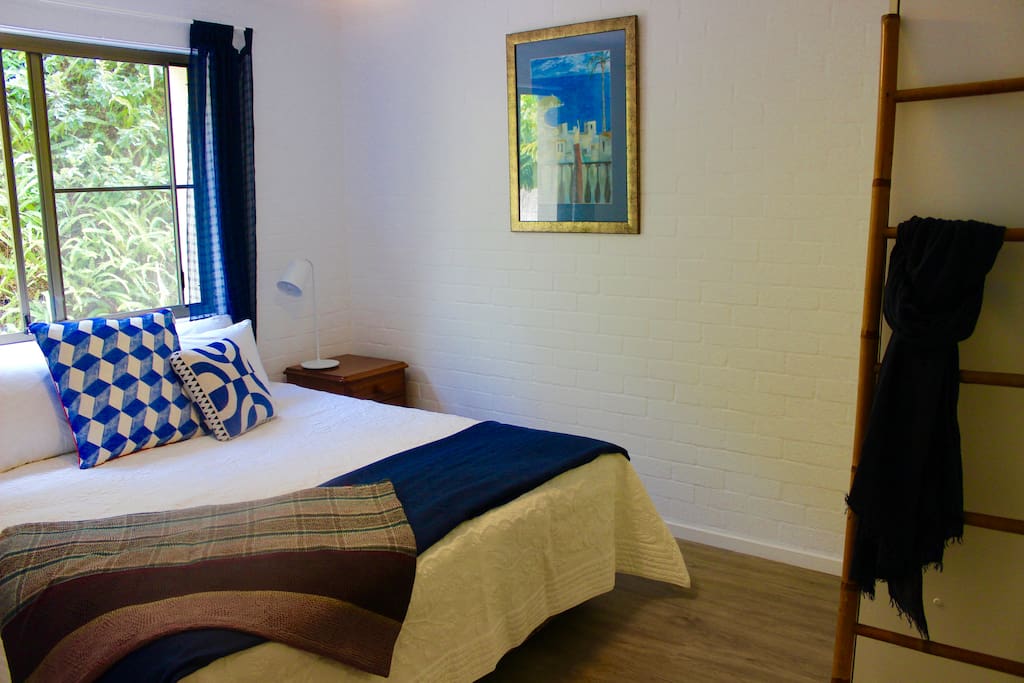 Your private room includes soft linens, ceiling fan, and large wardrobe.