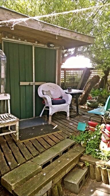 The little HUT porch ... fishpond peeping thru ...