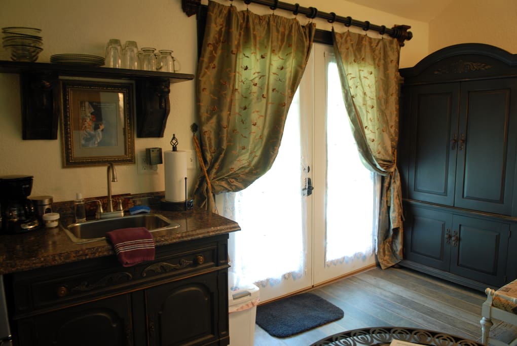 The large armoire is for hanging your clothes or putting clothes into so you don't have to live out of a suitcase....