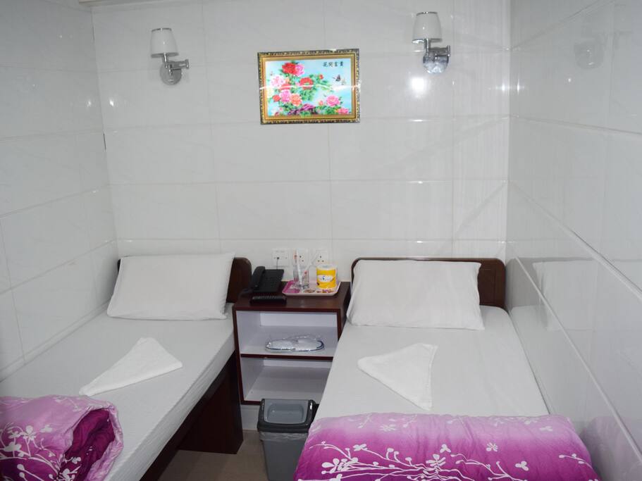 Twin Bed with
Toilet and Shower.