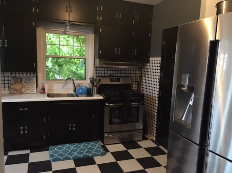 Full kitchen, lots of dinnerware, and equipped with a gas stove.