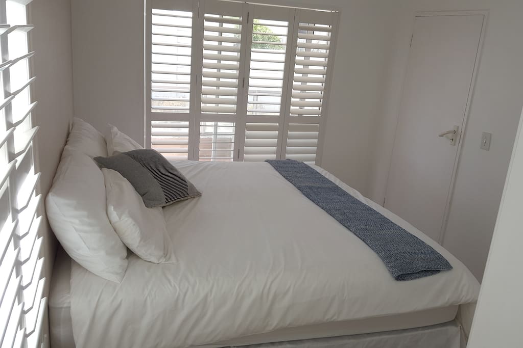 Main bedroom with sliding door leading to balcony with king or 2 x single beds
