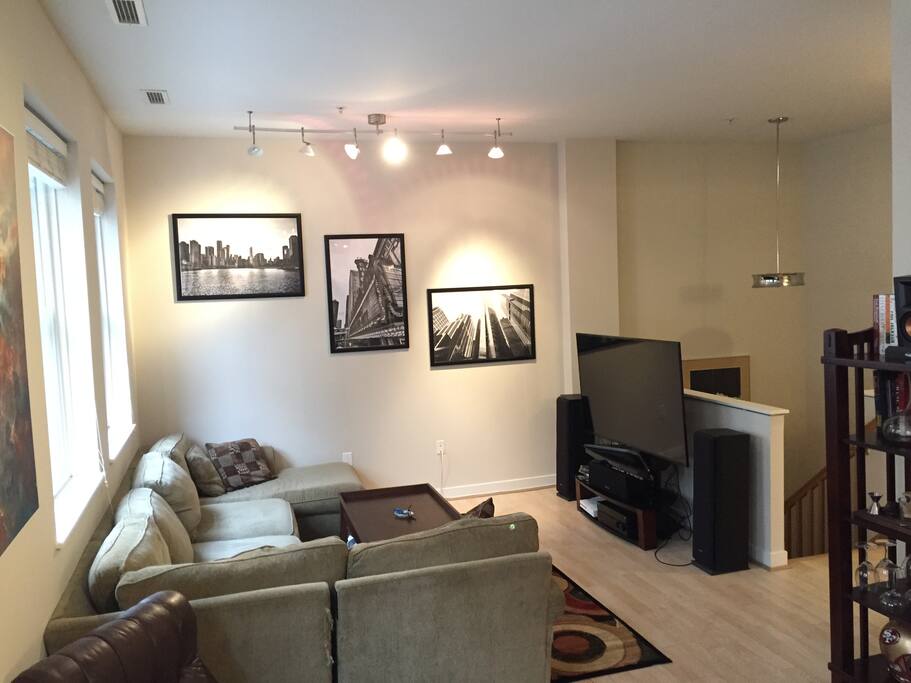 Spacious living area with 65" TV, Sound System, Apple TV, Chromecast, and Xbox One