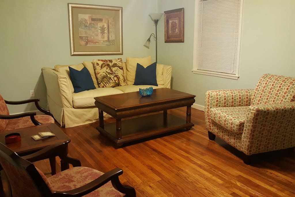 Livingroom with beautiful original hard wood floors.