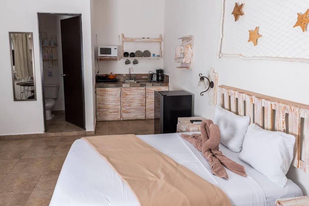 Cozy studio, with bed, kitchenette, and bathroom