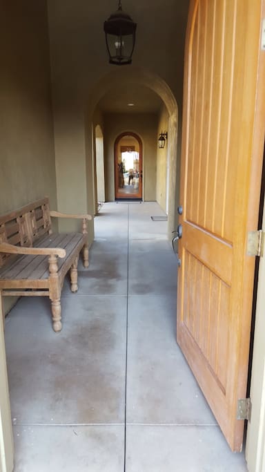 Front entrance into private enclosed courtyard with fireplace. Casita entrance located in here as well.