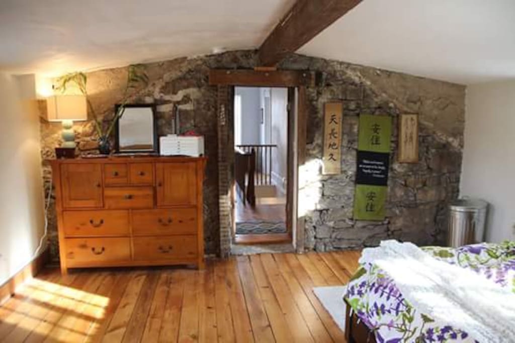 Master Bedroom--original stone wall